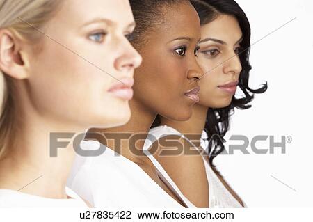 Portrait Of Three Attractive Young Women In Studio Standing In Line View Large Photo Image Stock Image - Portrait Of Three Attractive Young Women In Studio Standing In Line. Fotosearch