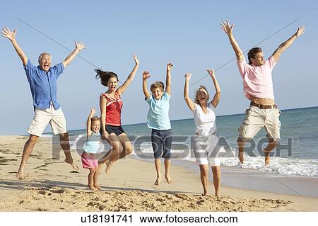 Portrait Of Three Generation Family On Beach Holiday Jumping In Air View Large Photo Image Stock Image - Portrait Of Three Generation Family On Beach Holiday Jumping In Air. Fotosearch