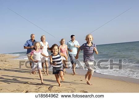 Portrait Of Three Generation Family On Beach Holiday View Large Photo Image Stock Image - Portrait Of Three Generation Family On Beach Holiday. Fotosearch