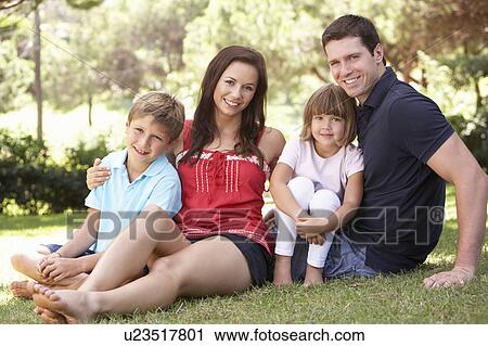 Portrait Of Young Family Relaxing In Park View Large Photo Image Stock Image - Portrait Of Young Family Relaxing In Park. Fotosearch