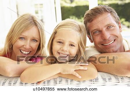 Portrait Of Young Family Relaxing Together On Sofa View Large Photo Image Stock Photography - Portrait Of Young Family Relaxing Together On Sofa. Fotosearch