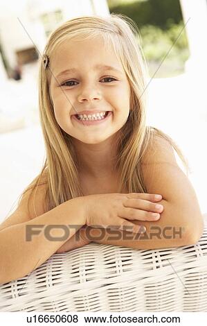Portrait Of Young Girl Relaxing On Sofa View Large Photo Image Stock Photo - Portrait Of Young Girl Relaxing On Sofa. Fotosearch