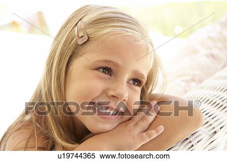 Portrait Of Young Girl Relaxing On Sofa View Large Photo Image Stock Photography - Portrait Of Young Girl Relaxing On Sofa. Fotosearch