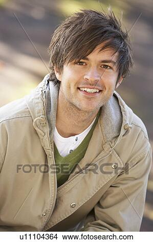 Picture - Portrait Of Young Man In Autumn Park. Fotosearch