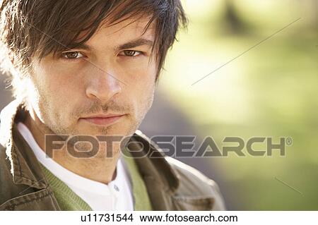 Picture - Portrait Of Young Man In Autumn Park. Fotosearch