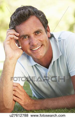 Portrait Of Young Man In Park View Large Photo Image Stock Photo - Portrait Of Young Man In Park. Fotosearch