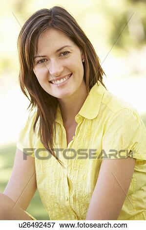 Portrait Of Young Woman In Park View Large Photo Image Stock Photo - Portrait Of Young Woman In Park. Fotosearch