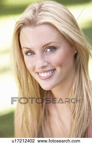 Portrait Of Young Woman Relaxing In Park View Large Photo Image Stock Image - Portrait Of Young Woman Relaxing In Park. Fotosearch