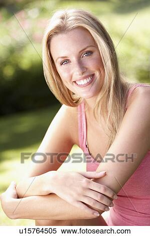 Portrait Of Young Woman Relaxing In Park View Large Photo Image Stock Photography - Portrait Of Young Woman Relaxing In Park. Fotosearch