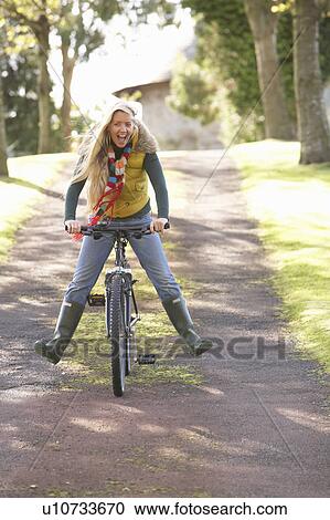 Portrait Of Young Woman With Cycle In Autumn Park View Large Photo Image Stock Image - Portrait Of Young Woman With Cycle In Autumn Park. Fotosearch
