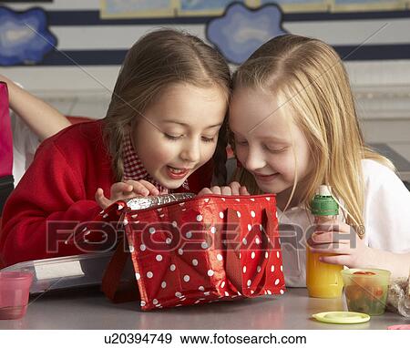 Primary School Pupils Enjoying Packed Lunch In Classroom View Large Photo Image Stock Photo - Primary School Pupils Enjoying Packed Lunch In Classroom. Fotosearch