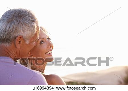Picture - Romantic Senior Couple in love at sunset. Fotosearch