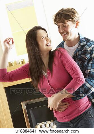 Romantic Young Couple Dancing Together In Living Room View Large Photo Image Stock Image - Romantic Young Couple Dancing Together In Living Room. Fotosearch