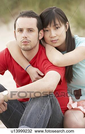 Romantic Young Couple Embracing On Beach View Large Photo Image Stock Image - Romantic Young Couple Embracing On Beach. Fotosearch