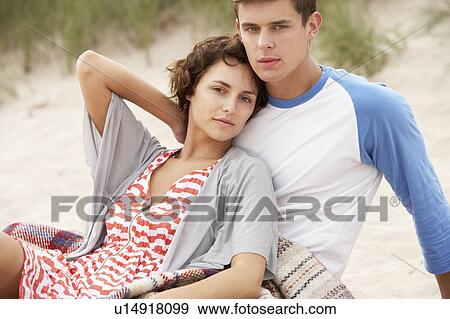 Romantic Young Couple Embracing On Beach View Large Photo Image Stock Photo - Romantic Young Couple Embracing On Beach. Fotosearch