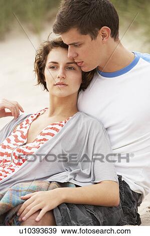 Romantic Young Couple Embracing On Beach View Large Photo Image Stock Photo - Romantic Young Couple Embracing On Beach . Fotosearch