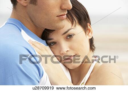 Romantic Young Couple Embracing On Beach View Large Photo Image Stock Photo - Romantic Young Couple Embracing On Beach . Fotosearch