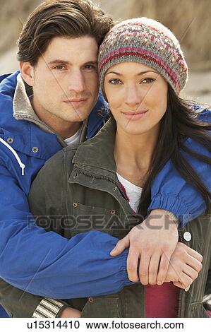 Stock Image - Romantic Young Couple On Winter Beach. Fotosearch