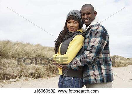 Romantic Young Couple On Winter Beach View Large Photo Image Stock Image - Romantic Young Couple On Winter Beach. Fotosearch