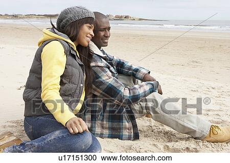 Romantic Young Couple On Winter Beach View Large Photo Image Stock Image - Romantic Young Couple On Winter Beach. Fotosearch