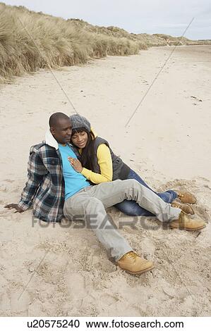 Stock Image - Romantic Young Couple On Winter Beach. Fotosearch