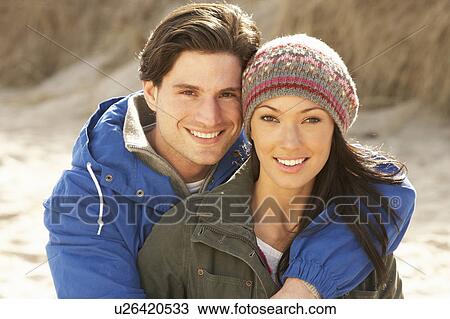 Romantic Young Couple On Winter Beach View Large Photo Image Stock Image - Romantic Young Couple On Winter Beach. Fotosearch