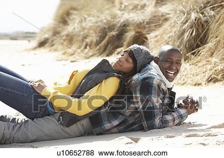 Romantic Young Couple On Winter Beach View Large Photo Image Stock Photo - Romantic Young Couple On Winter Beach. Fotosearch