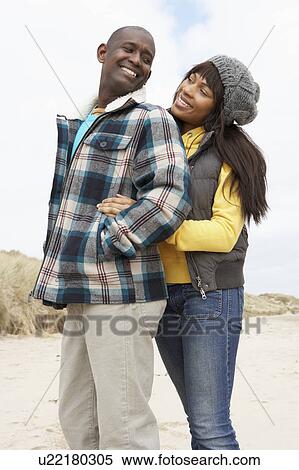 Romantic Young Couple On Winter Beach View Large Photo Image Stock Photography - Romantic Young Couple On Winter Beach. Fotosearch