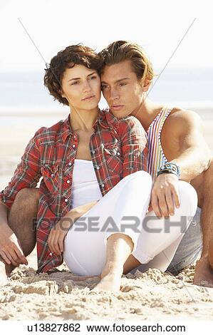 Romantic Young Couple Relaxing On Beach View Large Photo Image Stock Image - Romantic Young Couple Relaxing On Beach. Fotosearch