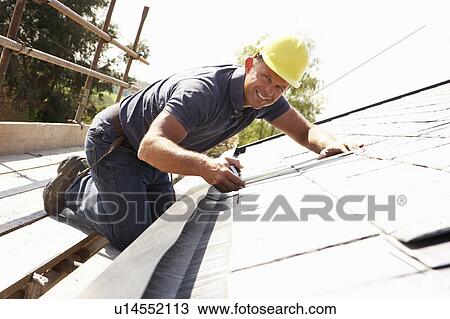 Roofer Working On Exterior Of New Home View Large Photo Image Stock Image - Roofer Working On Exterior Of New Home. Fotosearch