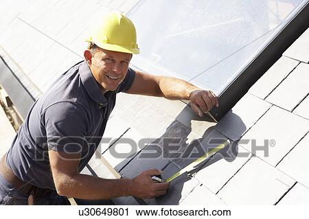Roofer Working On Exterior Of New Home View Large Photo Image Stock Image - Roofer Working On Exterior Of New Home. Fotosearch