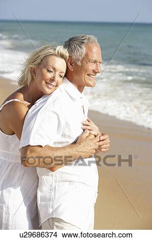 Senior Couple Enjoying Beach Holiday View Large Photo Image Picture - Senior Couple Enjoying Beach Holiday. Fotosearch