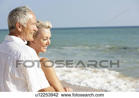 Senior Couple Enjoying Beach Holiday View Large Photo Image Stock Image - Senior Couple Enjoying Beach Holiday. Fotosearch