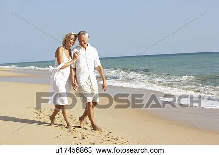 Senior Couple Enjoying Beach Holiday View Large Photo Image Stock Image - Senior Couple Enjoying Beach Holiday. Fotosearch