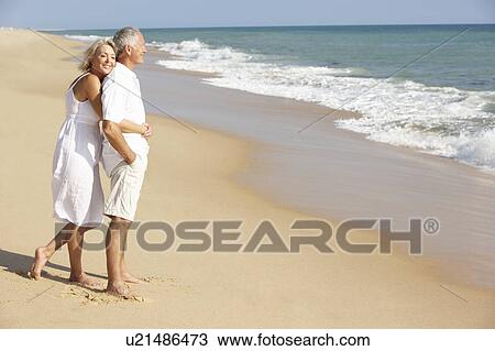 Senior Couple Enjoying Beach Holiday View Large Photo Image Stock Image - Senior Couple Enjoying Beach Holiday. Fotosearch