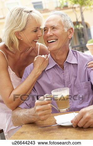 Senior Couple Enjoying Coffee And Cake In Café View Large Photo Image Stock Image - Senior Couple Enjoying Coffee And Cake In Café. Fotosearch