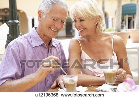 Senior Couple Enjoying Coffee And Cake In Café View Large Photo Image Stock Photo - Senior Couple Enjoying Coffee And Cake In Café. Fotosearch