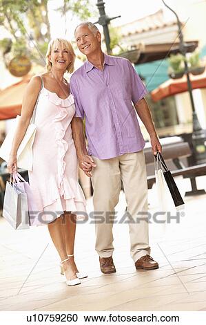 Senior Couple Enjoying Shopping Trip View Large Photo Image Stock Image - Senior Couple Enjoying Shopping Trip . Fotosearch