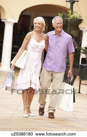 Senior Couple Enjoying Shopping Trip Together View Large Photo Image Stock Image - Senior Couple Enjoying Shopping Trip Together. Fotosearch