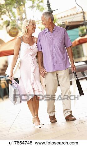 Senior Couple Enjoying Shopping Trip View Large Photo Image Stock Photo - Senior Couple Enjoying Shopping Trip . Fotosearch