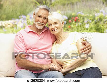 Senior Couple Relaxing In Garden View Large Photo Image Picture - Senior Couple Relaxing In Garden. Fotosearch