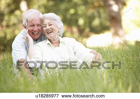 Stock Photo - Senior Couple Sitting In Park. Fotosearch