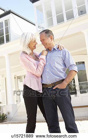 Senior Couple Standing Outside Dream Home View Large Photo Image Stock Photo - Senior Couple Standing Outside Dream Home. Fotosearch