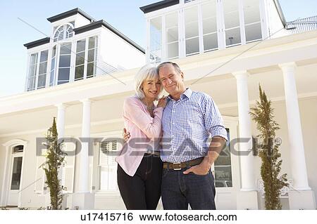 Senior Couple Standing Outside Dream Home View Large Photo Image Stock Photograph - Senior Couple Standing Outside Dream Home. Fotosearch