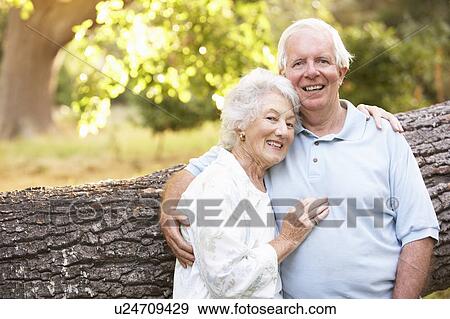 Senior Couple Walking In Park View Large Photo Image Stock Photo - Senior Couple Walking In Park. Fotosearch