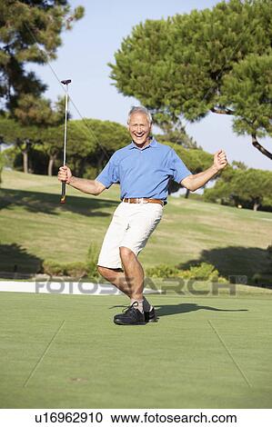 Senior Male Golfer On Golf Course Putting On Green View Large Photo Image Stock Image - Senior Male Golfer On Golf Course Putting On Green. Fotosearch