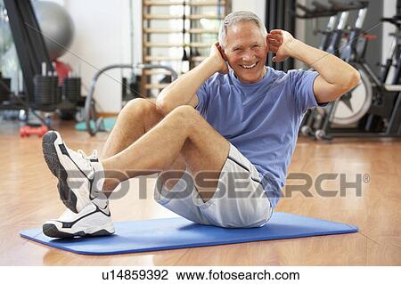 Senior Man Doing Sit Ups In Gym View Large Photo Image Stock Image - Senior Man Doing Sit Ups In Gym. Fotosearch