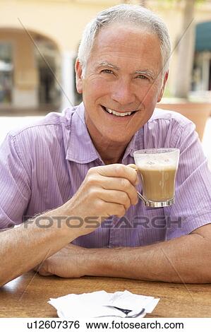 Senior Man Enjoying Coffee And Cake In Café View Large Photo Image Stock Photograph - Senior Man Enjoying Coffee And Cake In Café. Fotosearch
