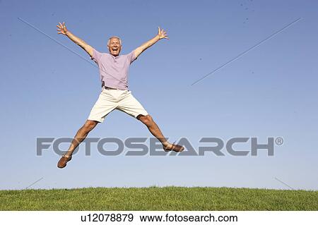 Senior man jumping in air View Large Photo Image Stock Photo - Senior man jumping in air. Fotosearch