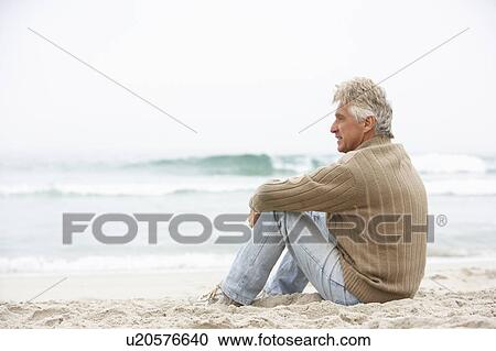 Senior Man On Holiday Sitting On Winter Beach View Large Photo Image Stock Image - Senior Man On Holiday Sitting On Winter Beach. Fotosearch